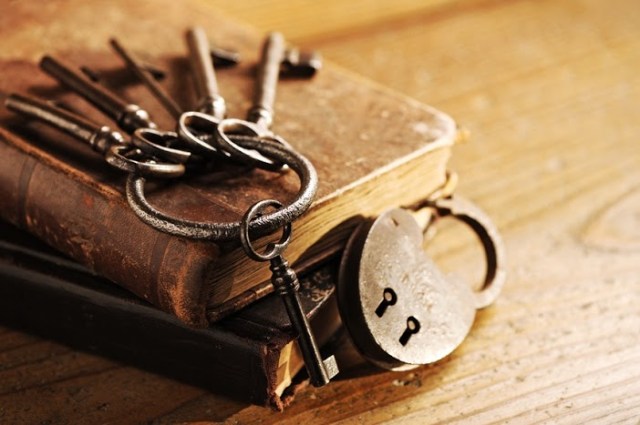 Old keys on a old book, antique wood background