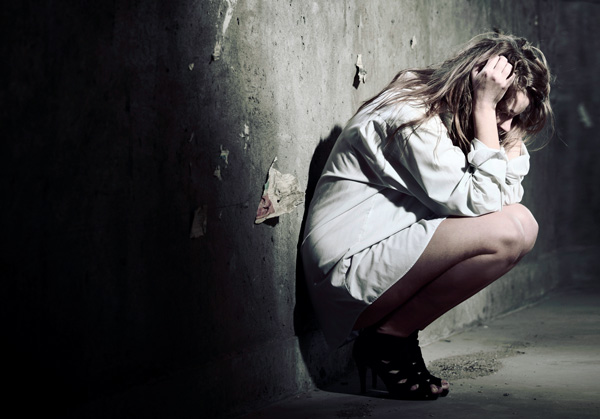 suffering - woman against wall