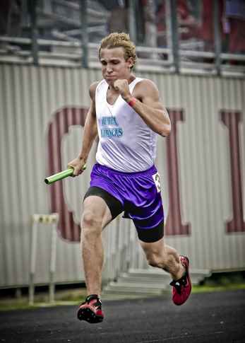 man wearing white jersey shirt running