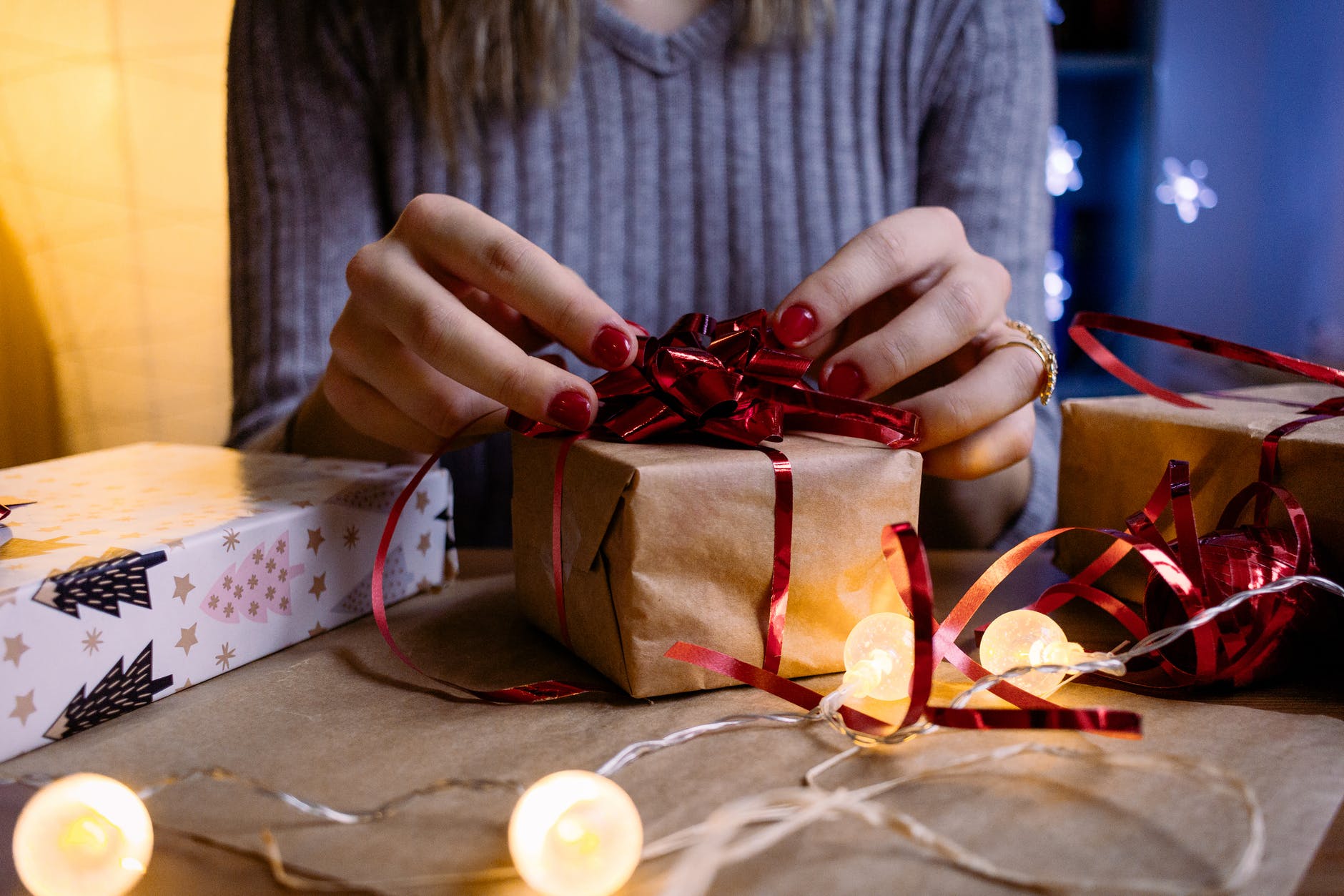 woman doing gift wrapping